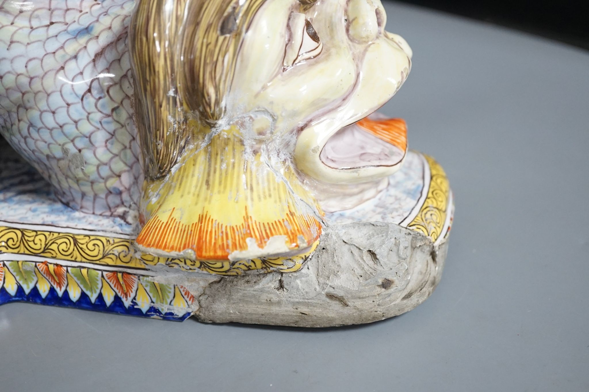 An 18th century Venetian maiolica ‘dolphin’ base and associated blush ivory cherubic figural bowl, 36cm